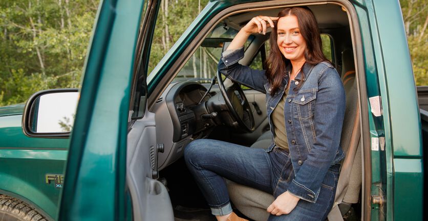 Woman sitting down in a truck